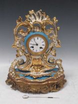 A late 19th century gilded porcelain balloon shaped mantel clock in the rococo taste by Henri Marc