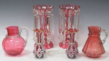 A pair of Victorian cranberry glass lustres together with a pair of Bohemian ruby glass vases (