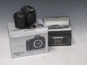 Canon EOS 5D MkII camera and an Olympus XA camera