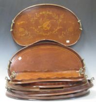 A collection of seven late 19th and early 20th century inlaid mahogany trays