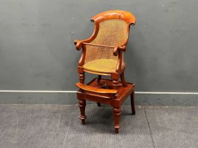 A 19th century mahogany child's caned bergere chair on stand. 98cm x 46cm x 48cm