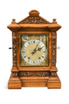 An Edwardian oak table clock,