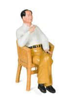 A Chinese porcelain seated figure of Chairman Mao,