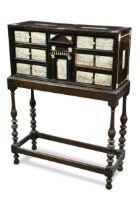 A southern Italian ebony, ivory and bone inlaid table cabinet on stand, 17th century,