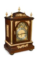 An imposing Edwardian mahogany and gilt metal mounted chiming table clock,