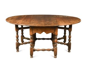 A large oak double gateleg table, early 18th century style,