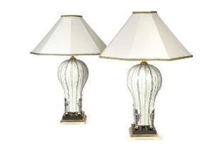A pair of Giulia Mangani porcelain table lamps and shades,