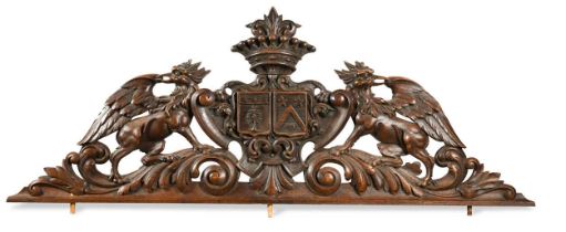 A carved heraldic over door, 19th century,