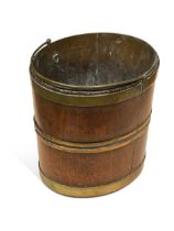 A George III mahogany brass bound peat bucket,