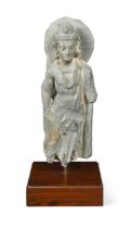 A Gandharan carved grey schist standing fragmental figure of Buddha, 3/4th century,