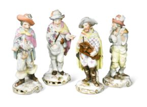 A group of four continental porcelain figurines,