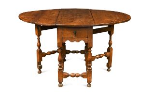 A walnut gateleg dining table, early 18th century,