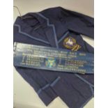 A Melbourne University rowing blade and blazer, both bearing University crest, the blade also