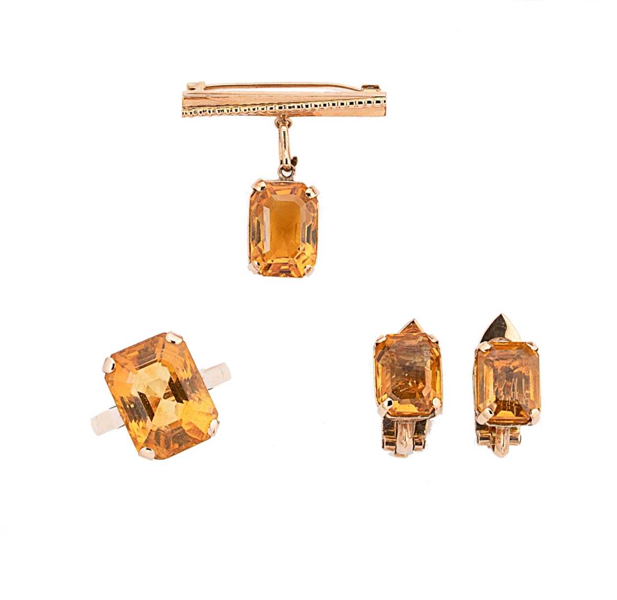 A citrine ring, brooch and a pair of ear clips,