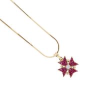 A ruby and diamond Maltese cross pendant and chain,
