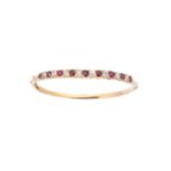 A Victorian ruby and diamond hinged bangle,