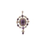 An early 20th century amethyst and split pearl pendant/brooch,