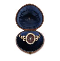 A Victorian garnet, split pearl and diamond hinged bangle,