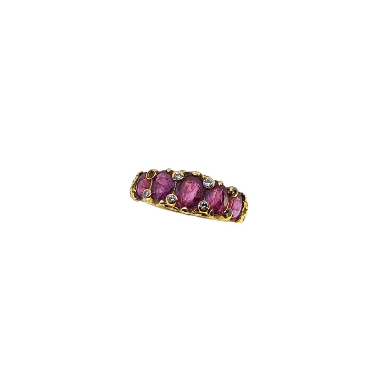A ruby and diamond carved half hoop style ring,