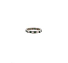An emerald and diamond full eternity ring,