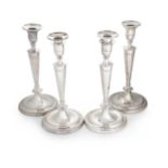 A set of 4 George III 18th century silver candlesticks, mark of John Schofield,