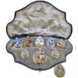 A 19th century lava cameo suite plus one other brooch,