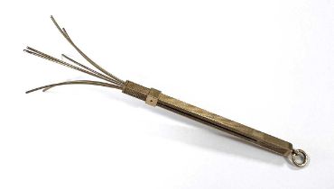 A mid 20th century 9ct gold sliding swizzle stick,