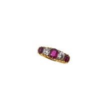 A ruby and diamond carved half hoop ring,
