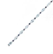 An aquamarine and sapphire line bracelet,