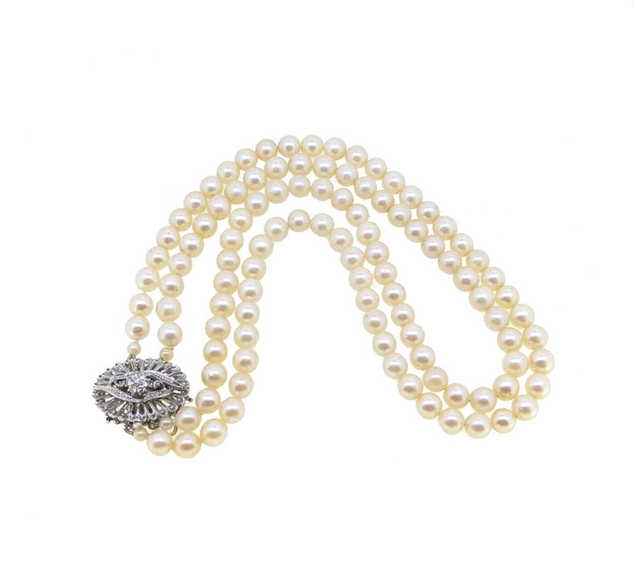 A double row pearl necklace, together with a pair of ear studs, - Image 2 of 2