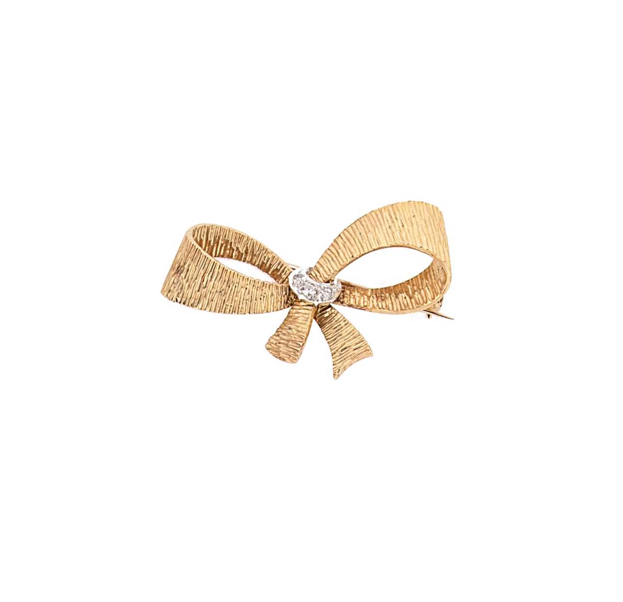 A late 20th century 18ct gold diamond set brooch,