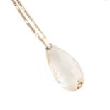 A citrine pendant and chain,