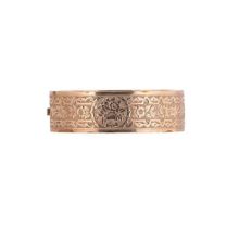 A half engraved hinged bangle,