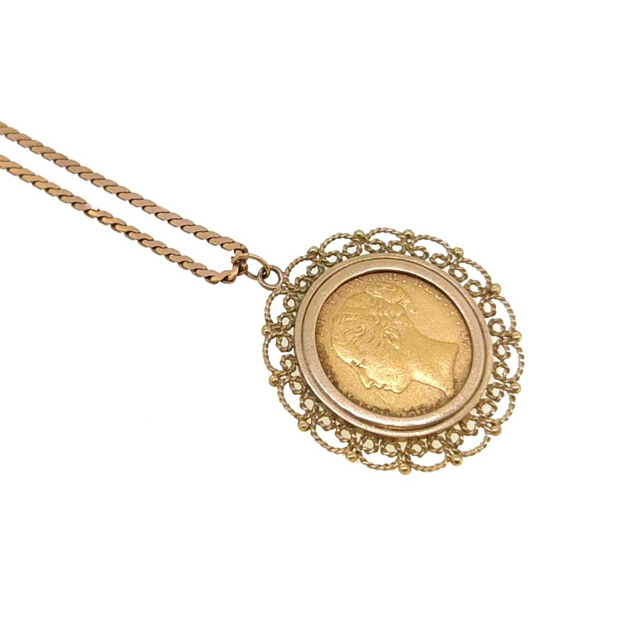 A full sovereign pendant and chain,