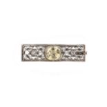 An early 20th century yellow sapphire and diamond set brooch,