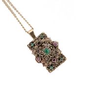 A gemset pendant and chain,