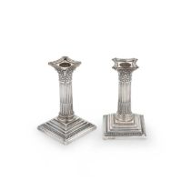 A pair of Elizabeth II silver library candlesticks,
