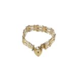 A late 20th century 9ct gold gate bracelet,