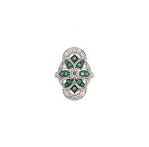 A modern emerald and diamond panel ring,