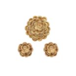 Kutchinsky - An 18ct gold flower brooch, together with a pair of matching ear studs,