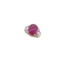 A cabochon ruby and diamond dress ring,