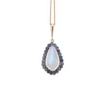 A sapphire and moonstone pendant and chain,