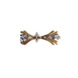 An 18ct gold diamond and sapphire brooch,