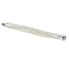 A four row pearl bracelet with a sapphire and diamond clasp,