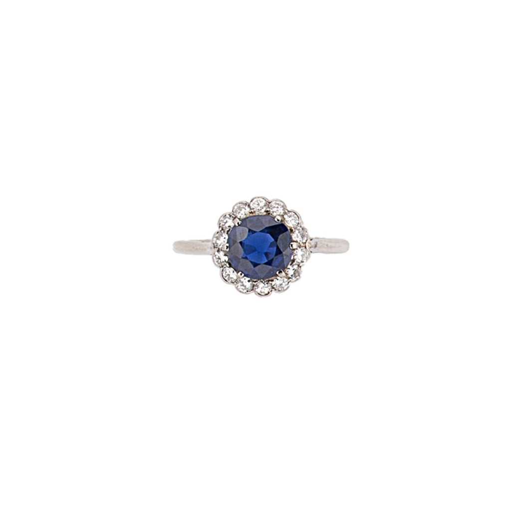 A mid 20th century sapphire and diamond cluster ring,