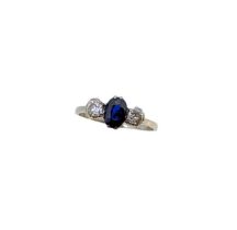 A three stone sapphire and diamond ring,