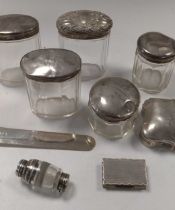 A silver paper knife, mark of Sampson Mordan, together with some silver topped glass cosmetics jars,
