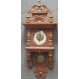 A carved oak wall clock circa 1900, 105cm high