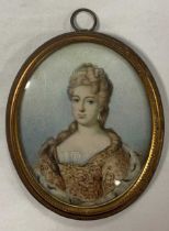 A collection of four portrait miniatures