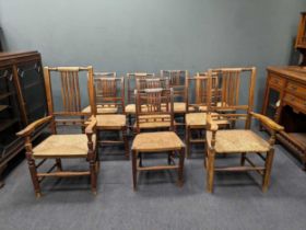 Eight stained-ash chairs with rush seat, with a further two carvers with rush seat (10)